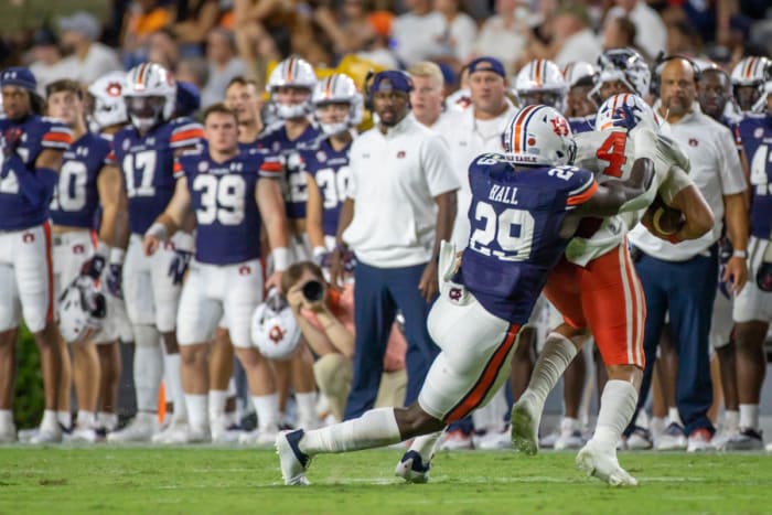 Auburn Tigers linebacker Derick Hall (29) tackles Mercer Bears quarterback Fred Payton (4) for a loss during the game between the Mercer Bears and the Auburn Tigers at Jordan-Hare Stadium on Sept. 3, 2022.